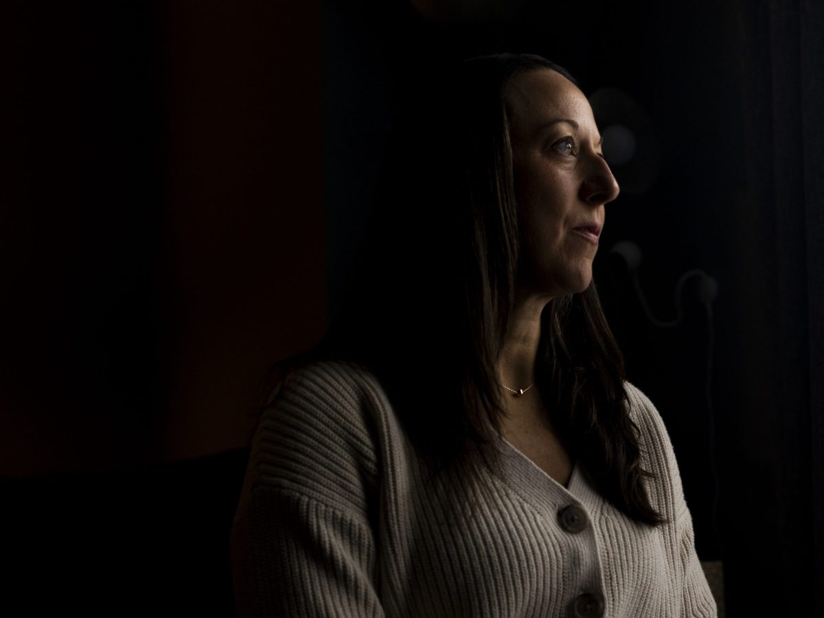 A portrait of Allison Herrst at her home in Ypsilanti, Michigan on Jan. 22, 2026. Emily Elconin for Bridge Michigan