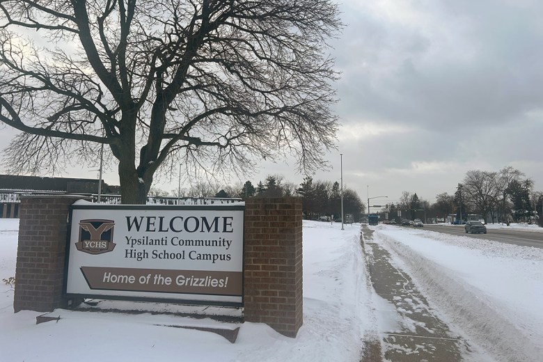 A welcome sign outside a high school campus in Ypsilanti