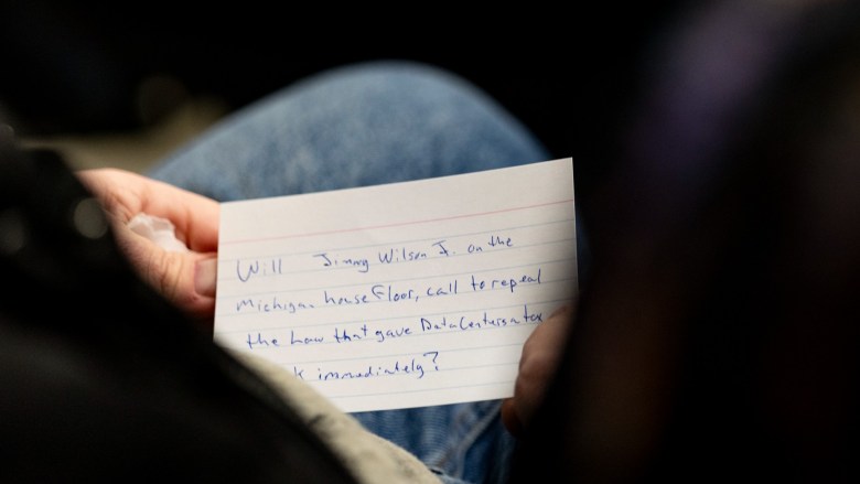 A closeup of a notecard with a question about data centers written on it
