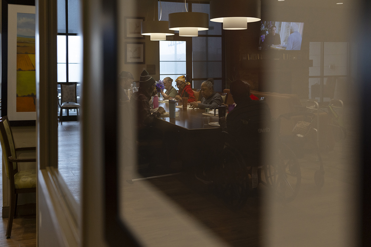 Green House residents gather at the table for dinner at the Thome Rivertown Senior Apartments in Detroit, Michigan, on Tuesday, Feb. 17, 2026.