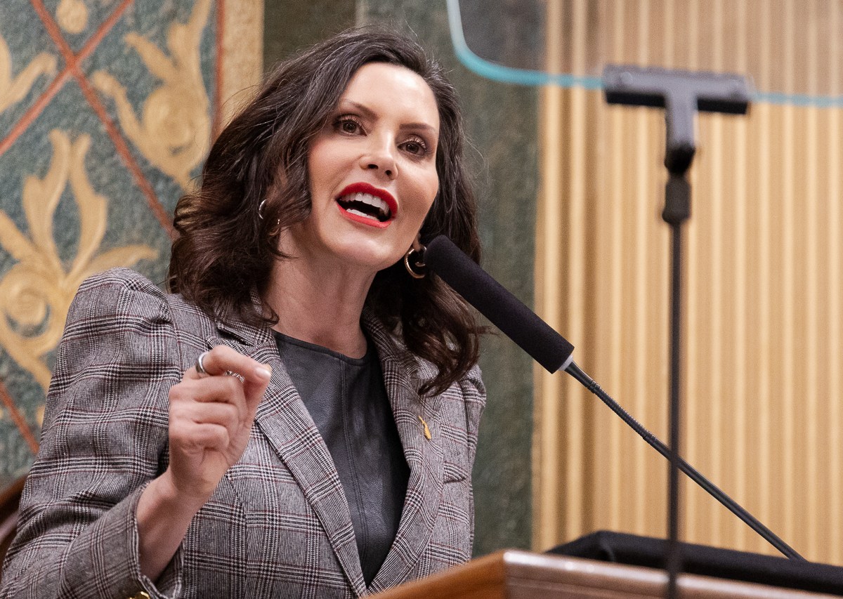 Michigan Gov. Gretchen Whitmer speaks into a microphone.