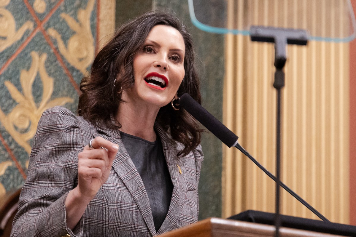 Michigan Gov. Gretchen Whitmer speaks into a microphone.