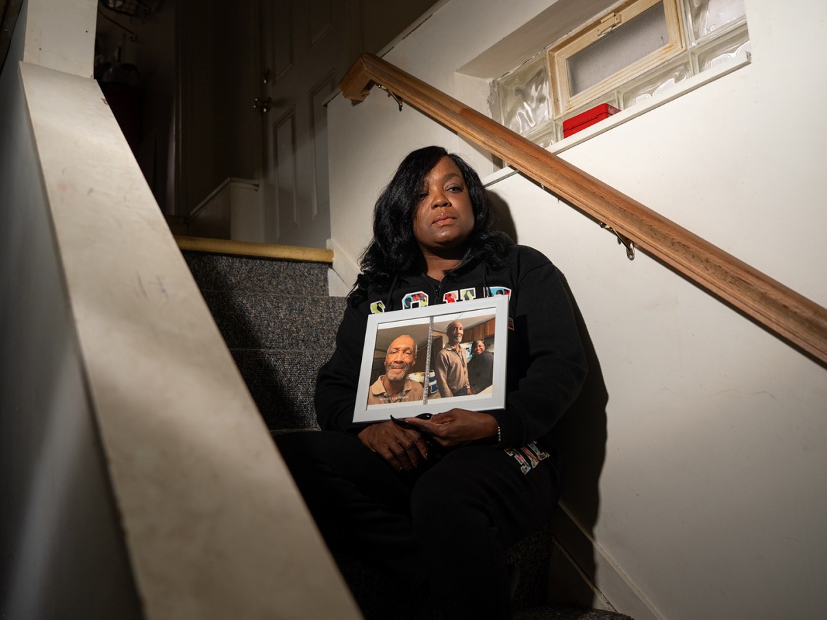 At her Detroit home, Shanica League, 52, holds a framed photo of her father, Morris Lee Wilson, who was 70 when he died in 2023 after developing infected bed sores that became fatal while he was living in a nursing facility, according to a lawsuit filed by his family.
