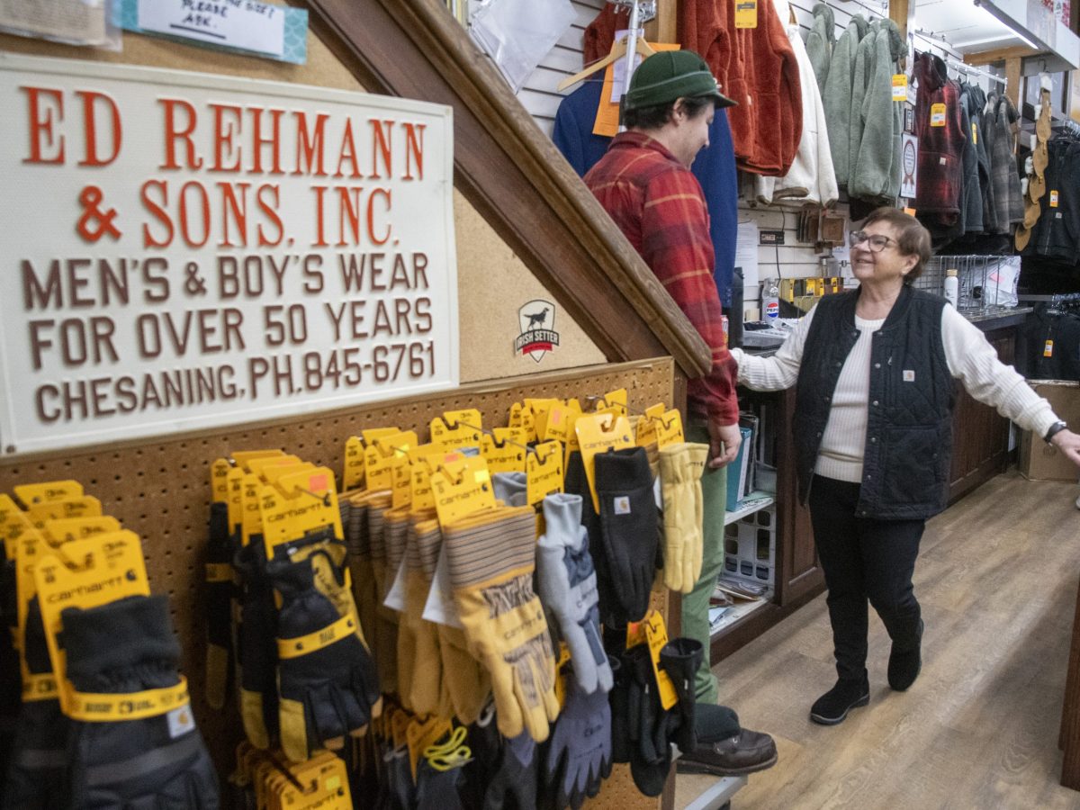 Two people talk inside a store