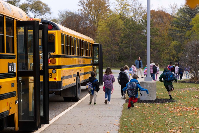 Pullen Elementary School Principal Emily Blahnik greets students as they arrive at Pullen Elementary School in Mount Pleasant, Mich.