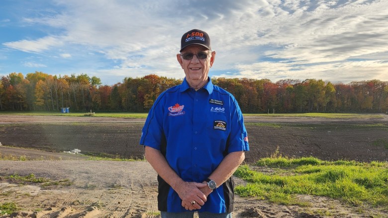 A man stands in a field