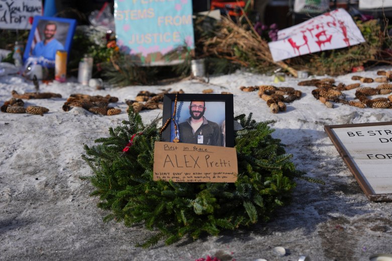 A photo of Alex Pretti surrounded by a wreath.