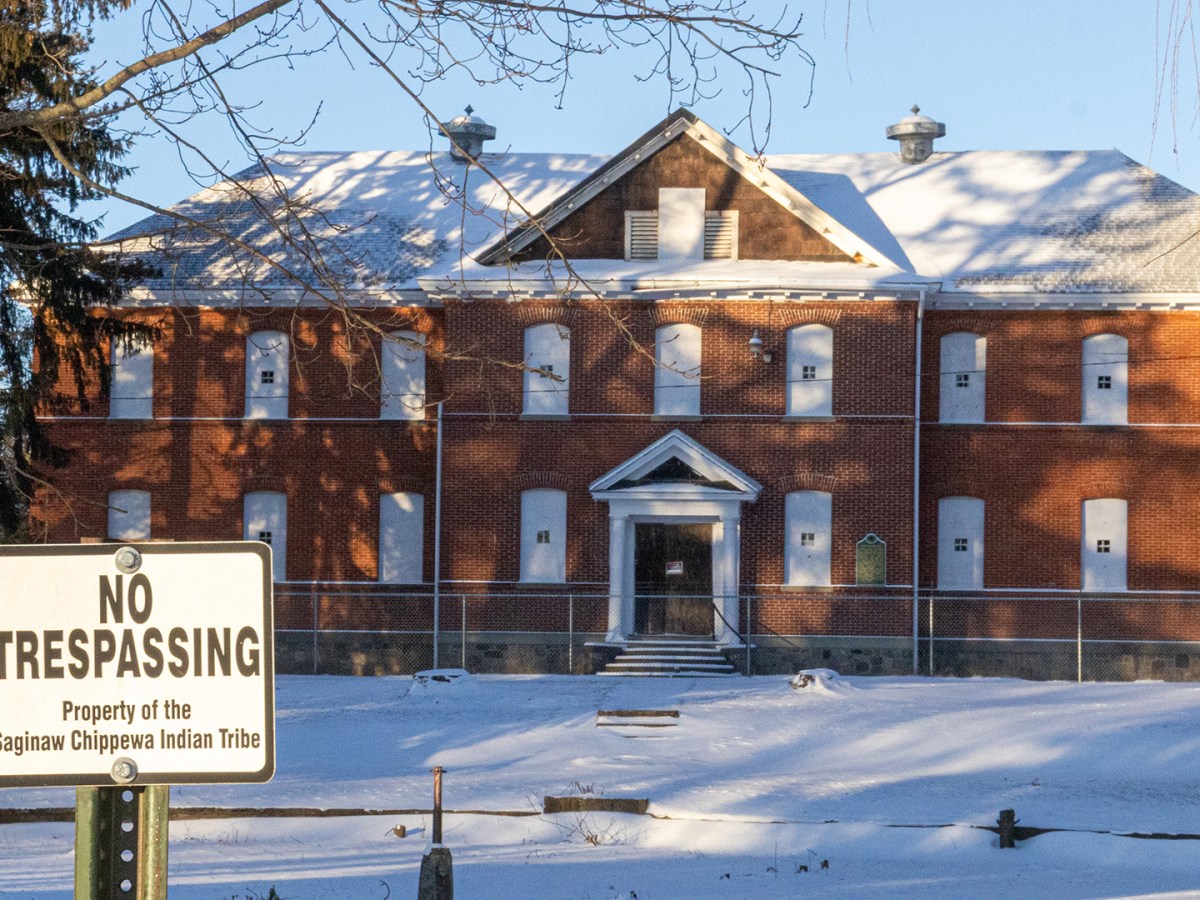A no trespassing sign stands in front of a boarded-up schoolhouse on the campus of the Mount Pleasant Indian Industrial Boarding School on Tuesday, Jan. 20, 2026.