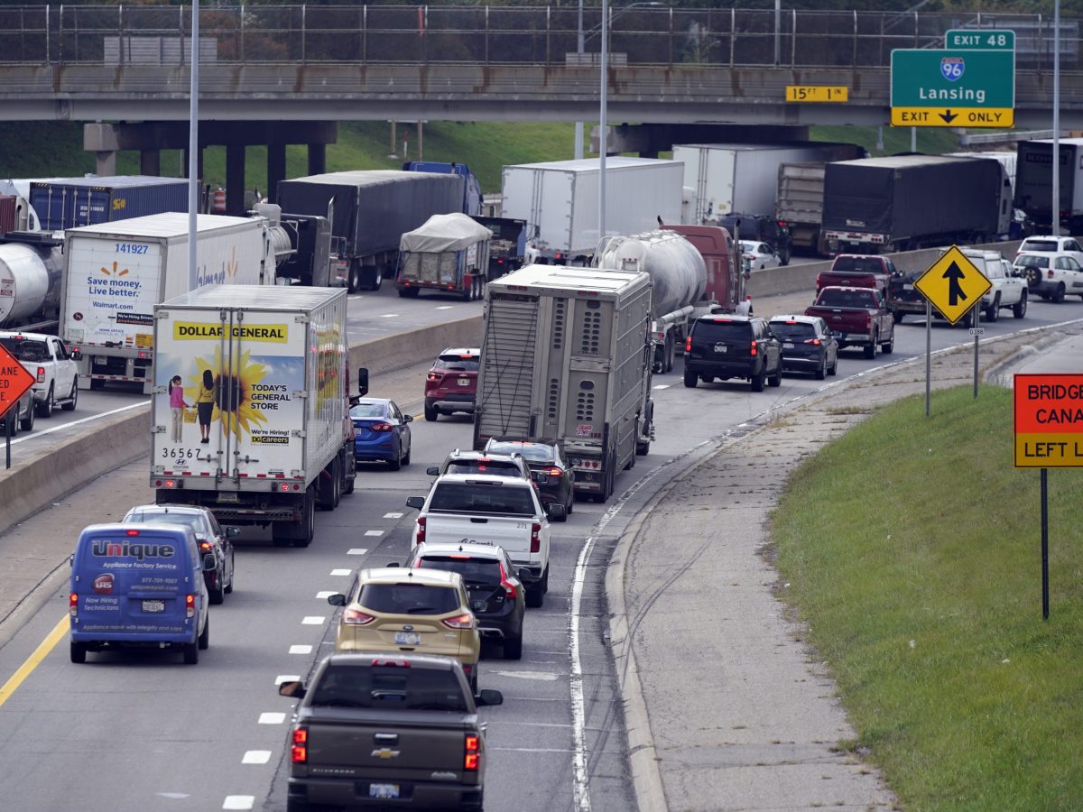 Traffic backs up on the interstate, Monday, Oct. 4, 2021, in Detroit. The busiest border crossing between Canada and the U.S. was closed to traffic for more than two hours on Monday after authorities found possible explosives during a vehicle inspection. (AP Photo/Carlos Osorio)