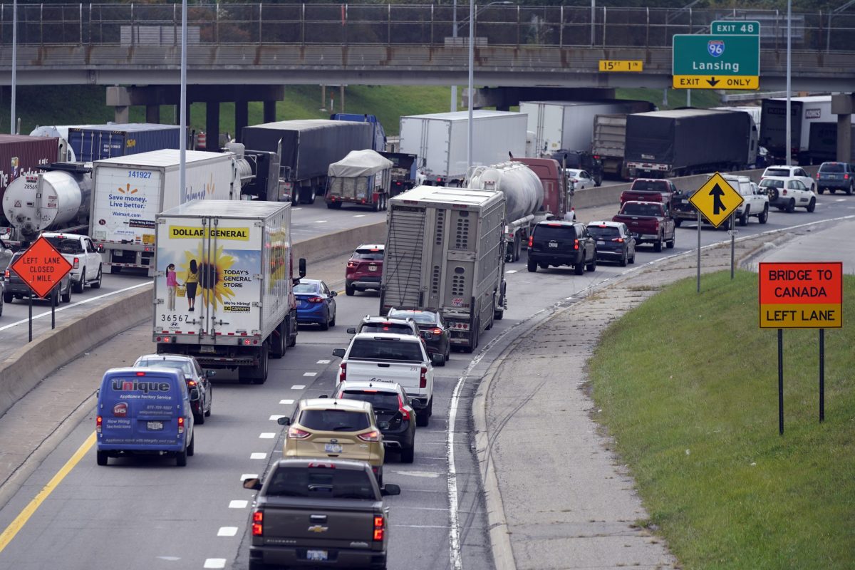 Traffic backs up on the interstate, Monday, Oct. 4, 2021, in Detroit. The busiest border crossing between Canada and the U.S. was closed to traffic for more than two hours on Monday after authorities found possible explosives during a vehicle inspection. (AP Photo/Carlos Osorio)