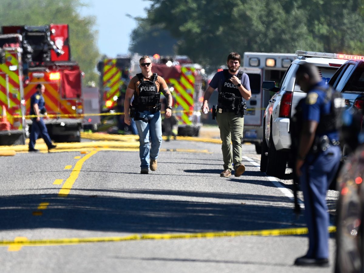 Law enforcement on a road after a shooting in Grand Blanc, Michigan, on Sept. 28, 2025.