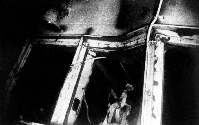A black-and-white photo of the damaged Edmund Fitzgerald underwater.