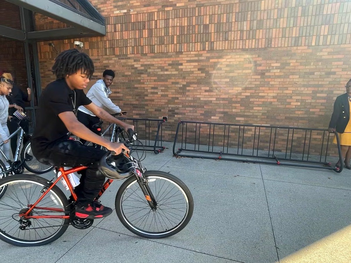 A teenager riding his bike.