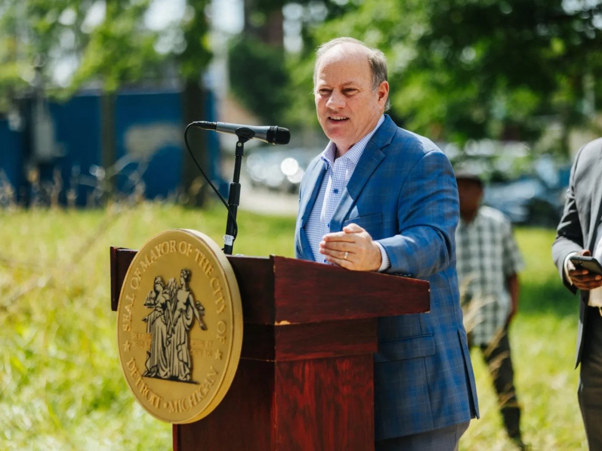 Detroit Mayor Mike Duggan speaking into the microphone