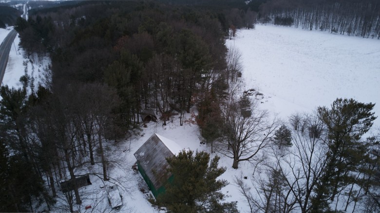 An aerial view of a farm in winter