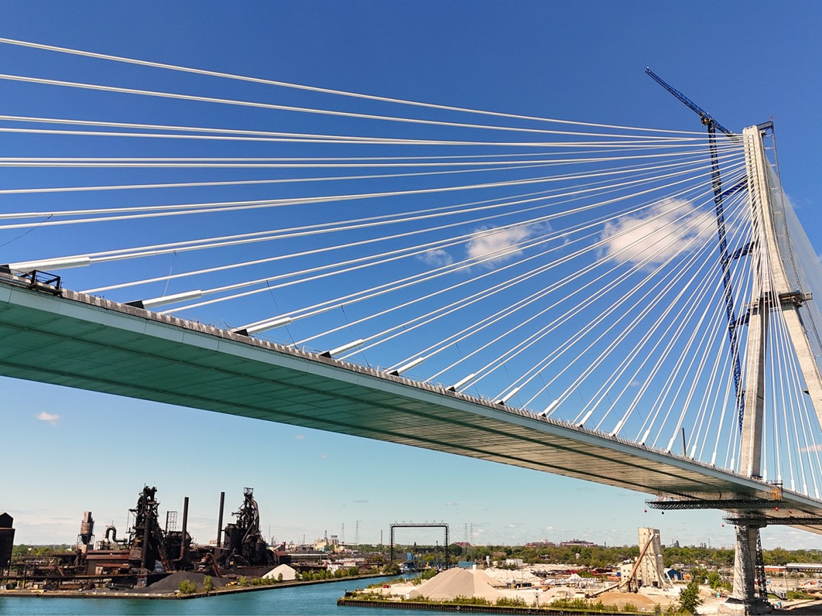 The Gordie Howe International Bridge in Detroit, MI. The shot depicts the tower on the US side with Zug Island situated under and behind the bridge.