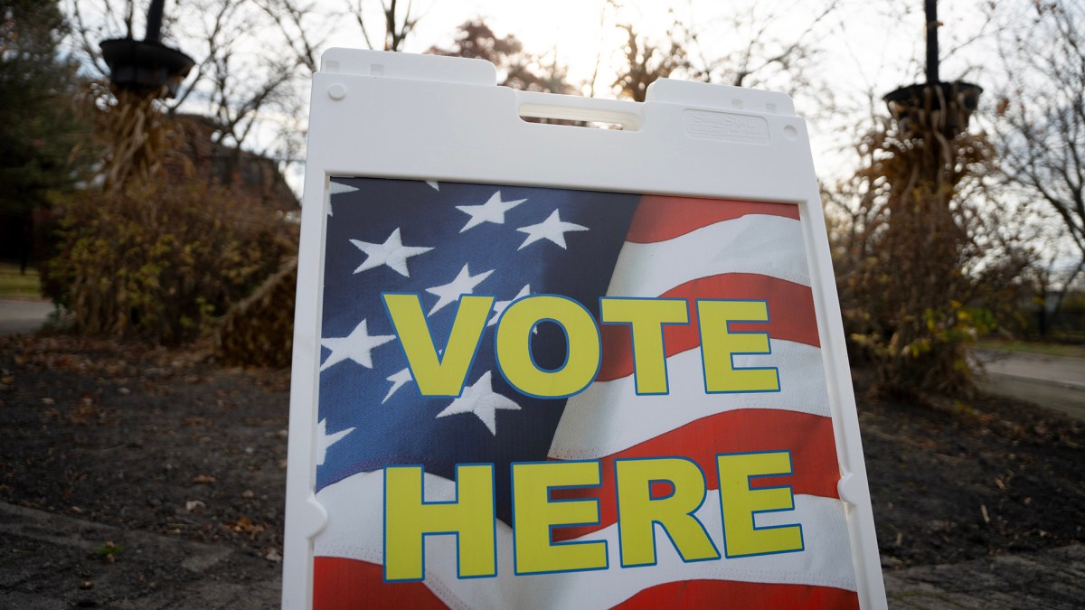 A sign that says "Vote Here."
