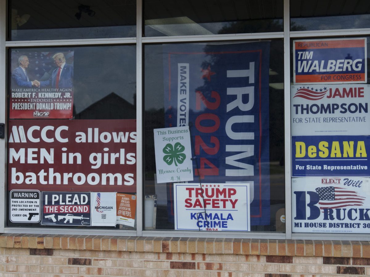 Signs in the window of the Monroe County Republican Party Center in Monroe, Mich. on Tuesday, Aug. 12, 2025.