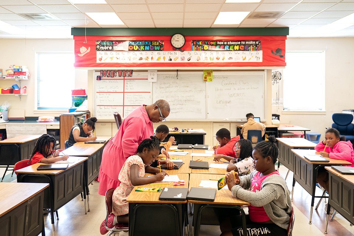 Teacher with her students in a classroom. 