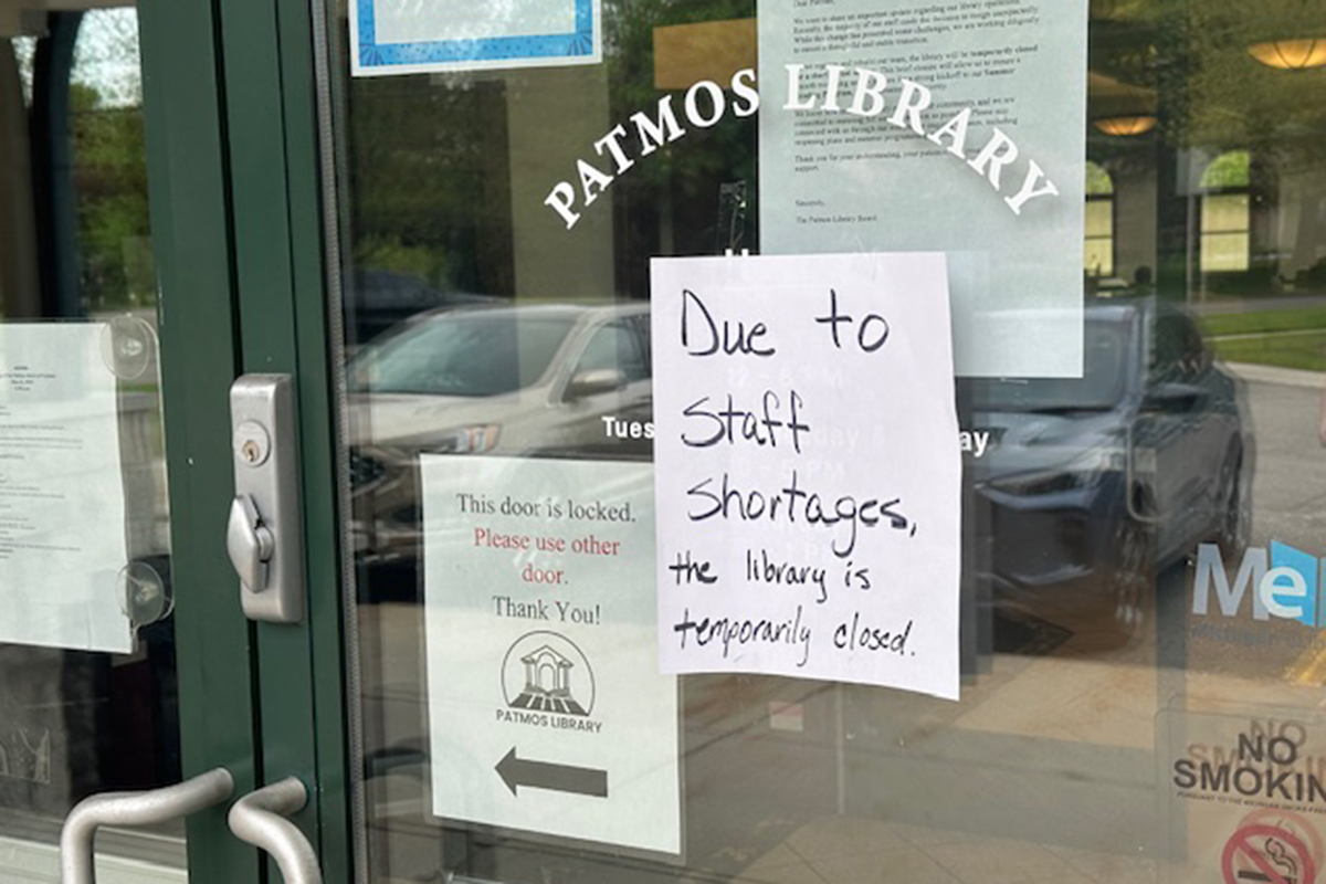 A sign stating the Patmos Public Library is closed due to a staff shortage.