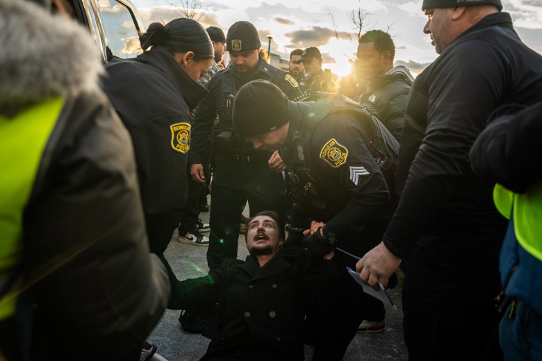 Someone on the ground. Police are helping him up.