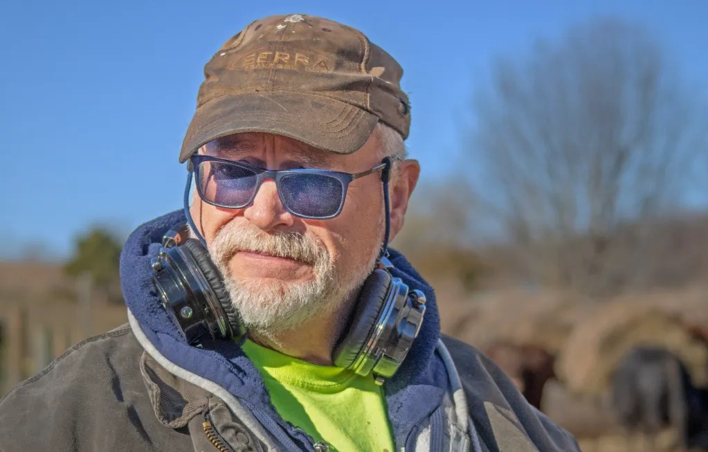 Close up of man wearing hat and glasses