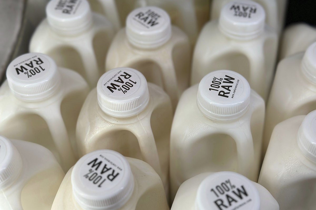 Bottles of raw milk from from Raw Farm of Fresno, Calif., are displayed for sale at a store in Temecula, Calif., on Wednesday, May 8, 2024.
