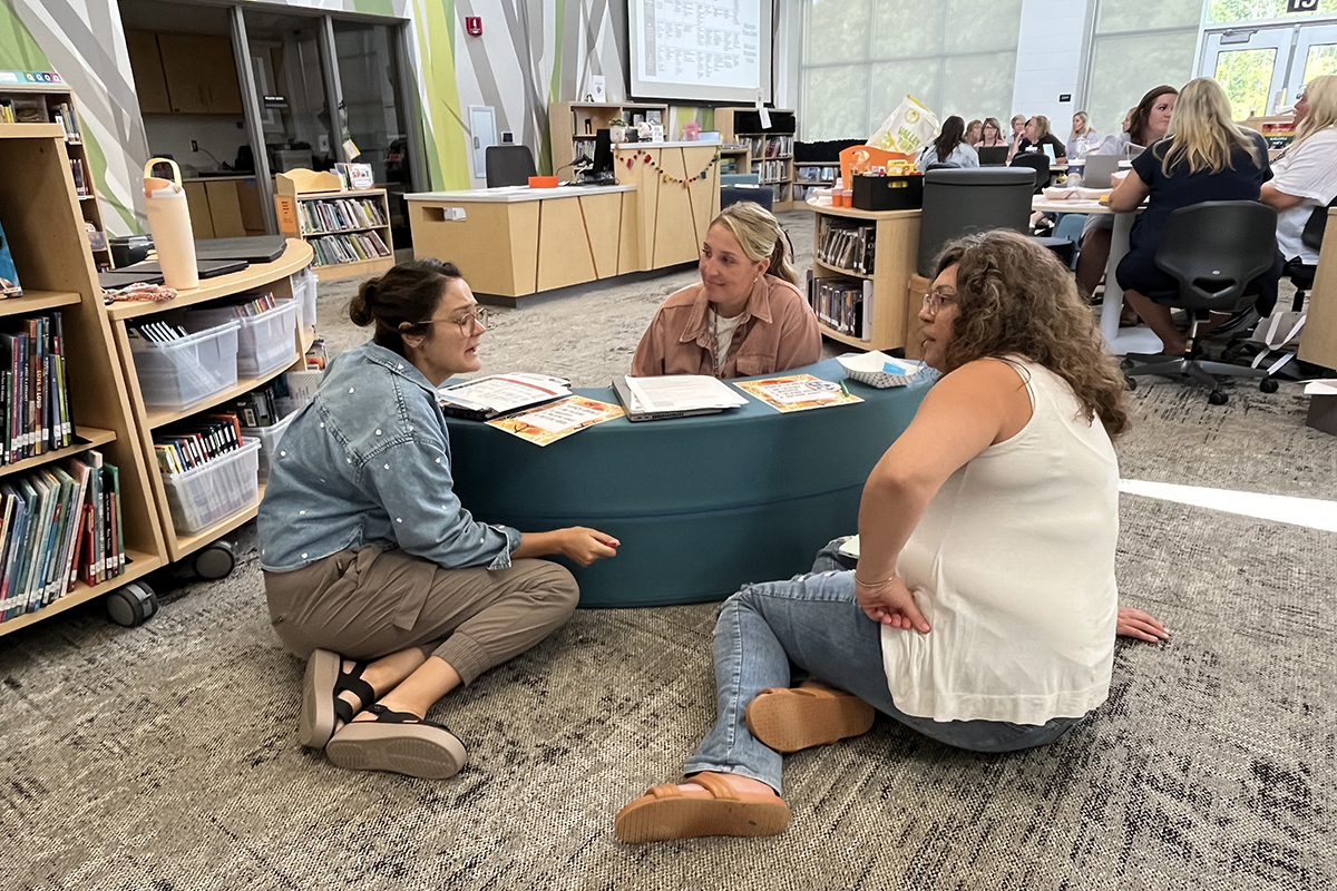 Rockford teachers sit around a table.