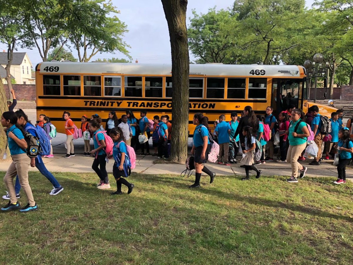Kids coming out of a school bus