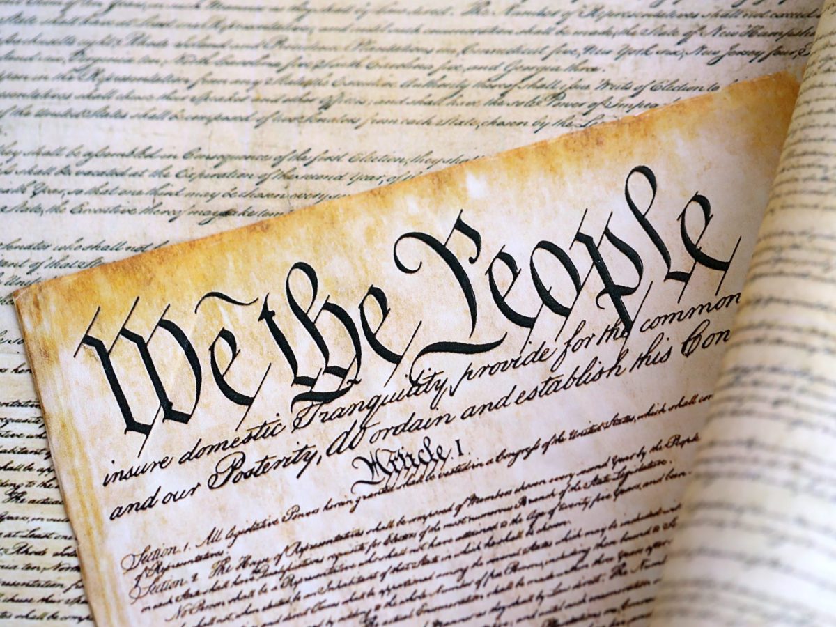 Overlapping images of the US Constitution on parchment