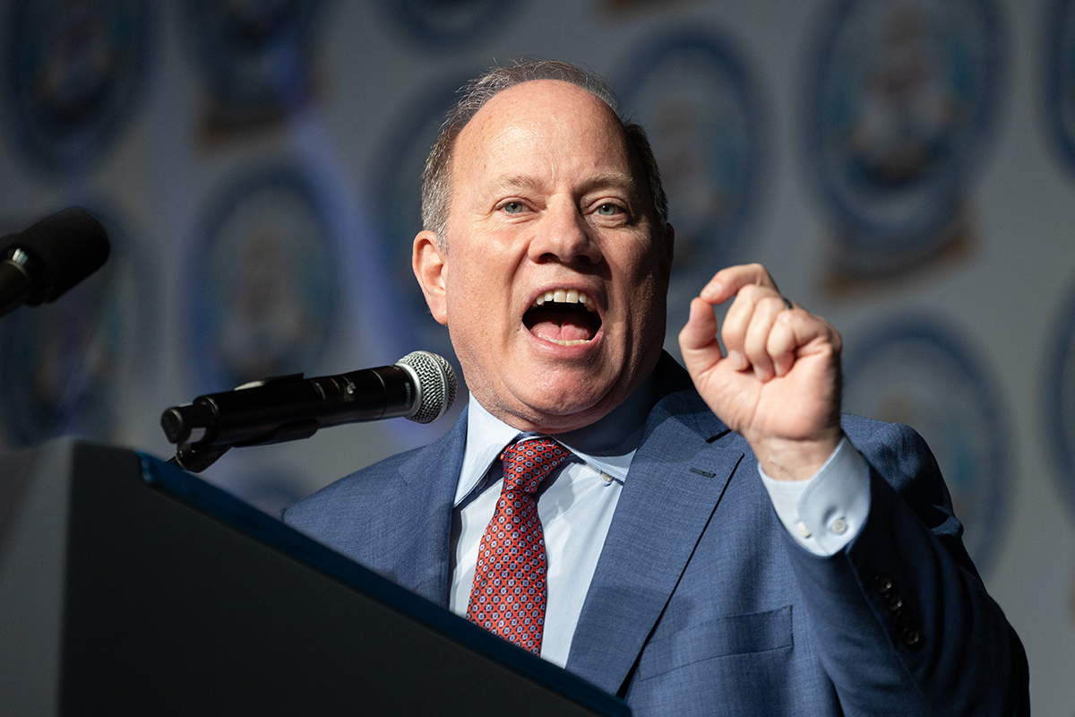 Detroit Mayor Mike Duggan speaking into a microphone
