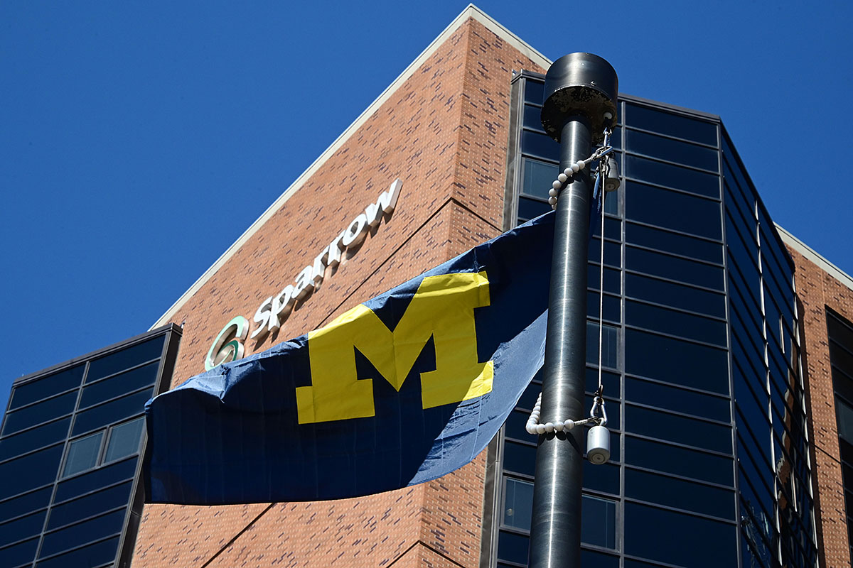 University of Michigan flag in front of Sparrow Hospital in Lansing.