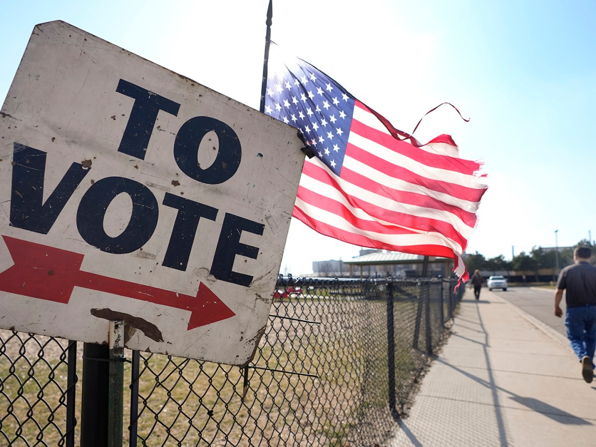 A voter walks to a Michigan primary election location in Dearborn, Mich., Tuesday, Feb. 27, 2024.